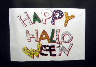 A poster saying "Happy Halloween"